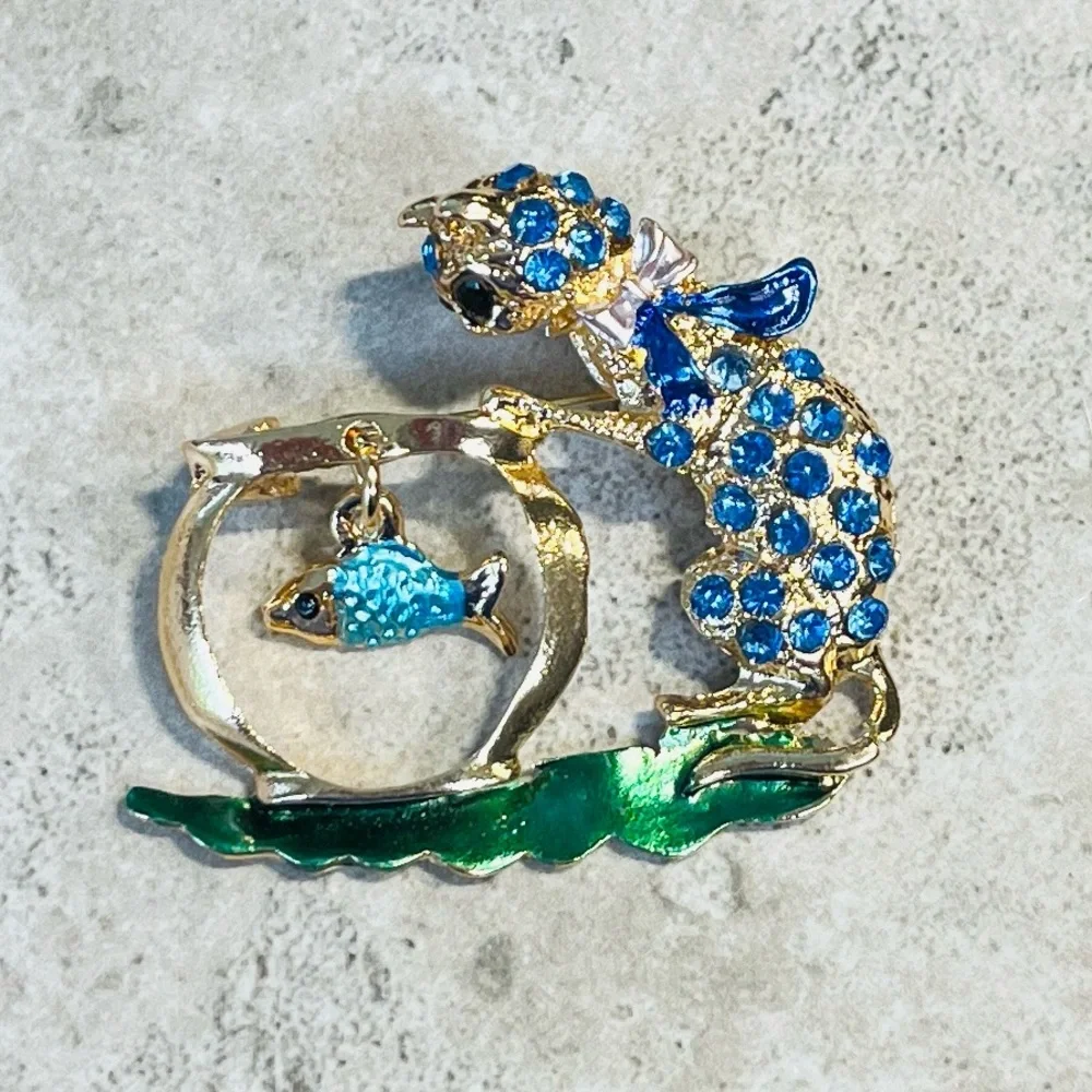 Brooch, Cat and Fish, NIP, blue rhinestones on golden base, 1.75x1.5”